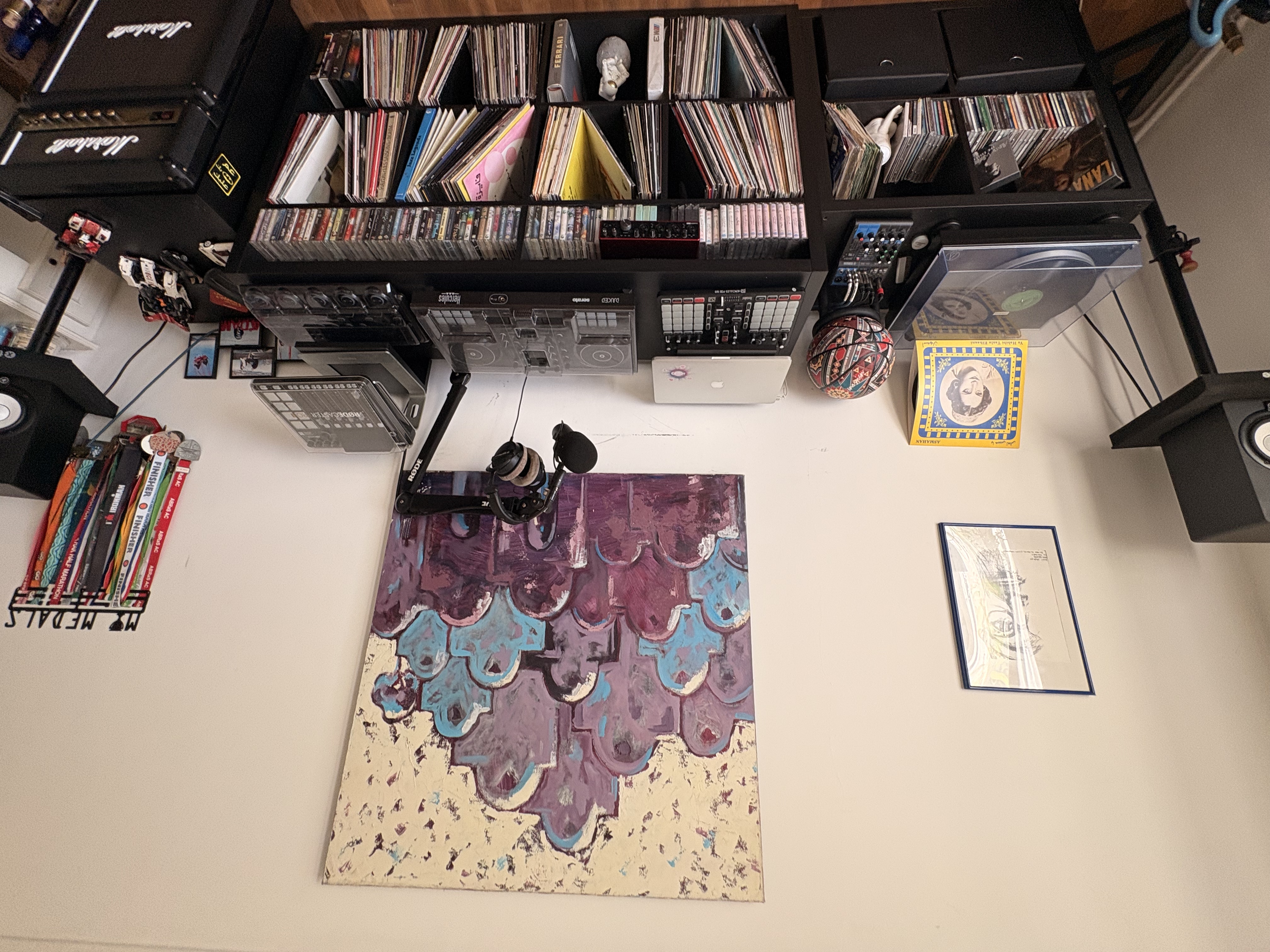 Nabil’s music room with a record player, mixing equipment, and shelves of vinyl records, cassettes, and CDs